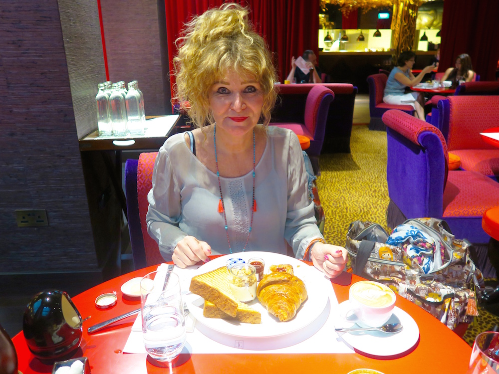 Woman having breakfast at Hotel Vagabond Singapore |curlytraveller.com